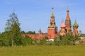 St. Basil`s Cathedral and Moscow Kremlin towers against green lawn on a sunny summer morning. View from Zaryadye Park Royalty Free Stock Photo