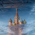 St. Basil's Cathedral on Red square in spring day reflected in the puddle. Moscow, Russia Royalty Free Stock Photo