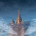 St. Basil's Cathedral on Red square in spring day reflected in the puddle. Moscow, Russia Royalty Free Stock Photo