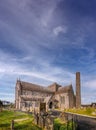 St Canice`s cathedral and cemetery in Kilkenny, Ireland, Europe, during sunny day with blue sky and clear blank space for text Royalty Free Stock Photo