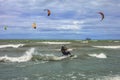 St. Catharines, Ontario, Canada - 09/04/2019 People kite surf on Lake Ontario on a sunny day.