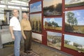 ST. CHARLES, UNITED STATES - Dec 23, 2008: artists looking at a gallery display