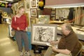 ST. CHARLES, UNITED STATES - Dec 23, 2008: woman purchasing art inside of a gallery shop