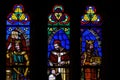 St. Denis Basilica, Paris France. Set of three colorful medieval era stained glass panels depicting monarchs, saints set