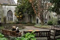 St Dunstan in the East Church Garden in London with a woman reading a book