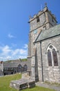 St Edward`s church with medieval houses in the background, Isle of Purbeck, Dorset, UK Royalty Free Stock Photo