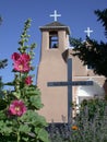 St. Francis of Asisi Catholic Church with Hollyhocks Royalty Free Stock Photo