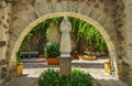St. Francis of Assisi statue in colonial garden Royalty Free Stock Photo