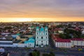 St. Francis Xavier Cathedral And Traffic In Mostowaja And Kirova Streets At Evening In Night Illuminations Lights. Sunset Sky. Royalty Free Stock Photo