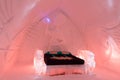 Bedroom in the world-renowned seasonal Ice HotelÃ¢â¬â¢s on the theme of ancient Egypt illuminated in pink Royalty Free Stock Photo