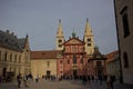 St. George Basilica in Prague. A crowd of tourists in the square in front of the basilica.