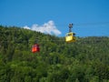 St Gilgen/Austria - June 2 2019: red and yellow tourist cable cars in austria Royalty Free Stock Photo