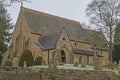 Old English rural village church with graveyard cemetary Royalty Free Stock Photo