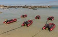 Holiday resort with red dinghies for rent. St Ives, UK