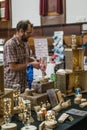 Man on an art and antique flea market