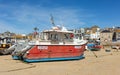 St Ives Harbour at low tide with fishing boats waiting for high tide, Corwall, UK 27 August 2022