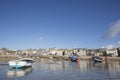 St Ives Harbour and town from the sea. Fishing boats at low tide. Royalty Free Stock Photo