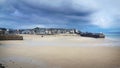 St Ives Harbour at low tide Cornwall with threatening sky Royalty Free Stock Photo