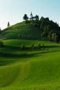 Beautiful scenery of green hill with catholic church on top Royalty Free Stock Photo