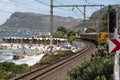 St James beach and colourful beach huts and train. Cape Town South Africa