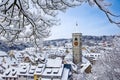 The St. Johan church tower over the old town roofs after a winter snow fall Royalty Free Stock Photo