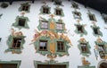 St. Johann, Austria - October 13, 2016: Painted wall of a house in the Tyrol. The windows are decorated with an elegant Royalty Free Stock Photo