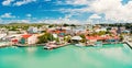 Cute houses with yacht, boat at harbor, St. John, Antigua Royalty Free Stock Photo