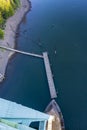 St Johns Bridge support and small floating pier on Willamette ri Royalty Free Stock Photo