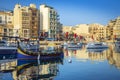 St.Julian`s, Malta - Colorful Luzzu fishing boats at Spinola bay Royalty Free Stock Photo