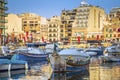 St.Julian`s, Malta - Traditional Luzzu fishing boats at Spinola Royalty Free Stock Photo