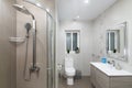 St Julians, Malta - April 28th 2020: Comtemporary beige coloured bathroom with shower cubicle