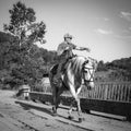 31st July, Russia, Altay, cowboy on horse rides at bridge