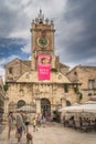 St. Lawrence Church in old town square with tourists in restaurant and beer garden