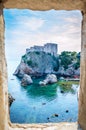 St. Lawrence Fortress view through a window in Bokar Fortress, Dubrovnik. Croatia Royalty Free Stock Photo