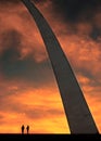 St Louis Arch Metal Gateway Landmark at Sunset with People Silhouette Couple Walking