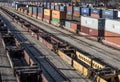 St. Louis, Missouri, United States-circa 2018-long line of train well cars and double stack freight container rail cars on tracks