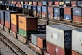 St. Louis, Missouri, United States-circa 2018-long line of train well cars and double stack freight container cars in trainyard Royalty Free Stock Photo