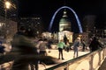 St Louis, Missouri, USA, Dec 2019 - ice skaters in front of St Louis Gateway Arch and Old Courthouse downtown, winter Royalty Free Stock Photo