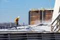 St. Louis, Missouri, USA, December 2020 - Deckhand hoses corn grain off barge deck cover after loading on Mississippi River Royalty Free Stock Photo