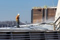 St. Louis, Missouri, USA, December 2020 - Deckhand hoses corn grain off barge deck cover after loading on Mississippi River Royalty Free Stock Photo