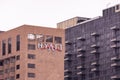 The logo and sign of Hyatt hotel network on a side of a brick building