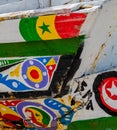 St Louis, Senegal - October 12, 2014: Colorful painted wooden fishing boats or pirogues at coast of St. Louis