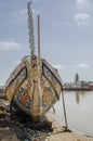 St Louis, Senegal - October 12, 2014: Colorful painted wooden fishing boats or pirogues at coast of St. Louis