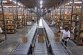 Workers packing and shipping boxes in warehouse