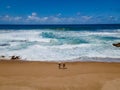 St Lucia South Africa, Rocks sand ocean, and blue coastal skyline at Mission Rocks beach near Cape Vidal in Isimangaliso Royalty Free Stock Photo