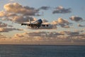 St Maarten, Caribbean, Maho Bay airport Boeing 747 KLM arriving out of the sunset from over the ocean Royalty Free Stock Photo