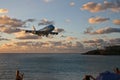 St Maarten, Caribbean, Maho Bay airport Boeing 747 KLM arriving out of the sunset from over the ocean Royalty Free Stock Photo