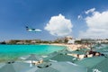 ST MAARTEN, CARIBBEAN - SEPTEMBER 21, 2013: airplane landing ove