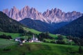 St Magdalena church in Val di Funes valley, Dolomites, Italy. Furchetta and Sass Rigais mountain peaks in background Royalty Free Stock Photo