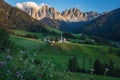 St Magdalena church in Val di Funes valley, Dolomites, Italy. Furchetta and Sass Rigais mountain peaks in background Royalty Free Stock Photo